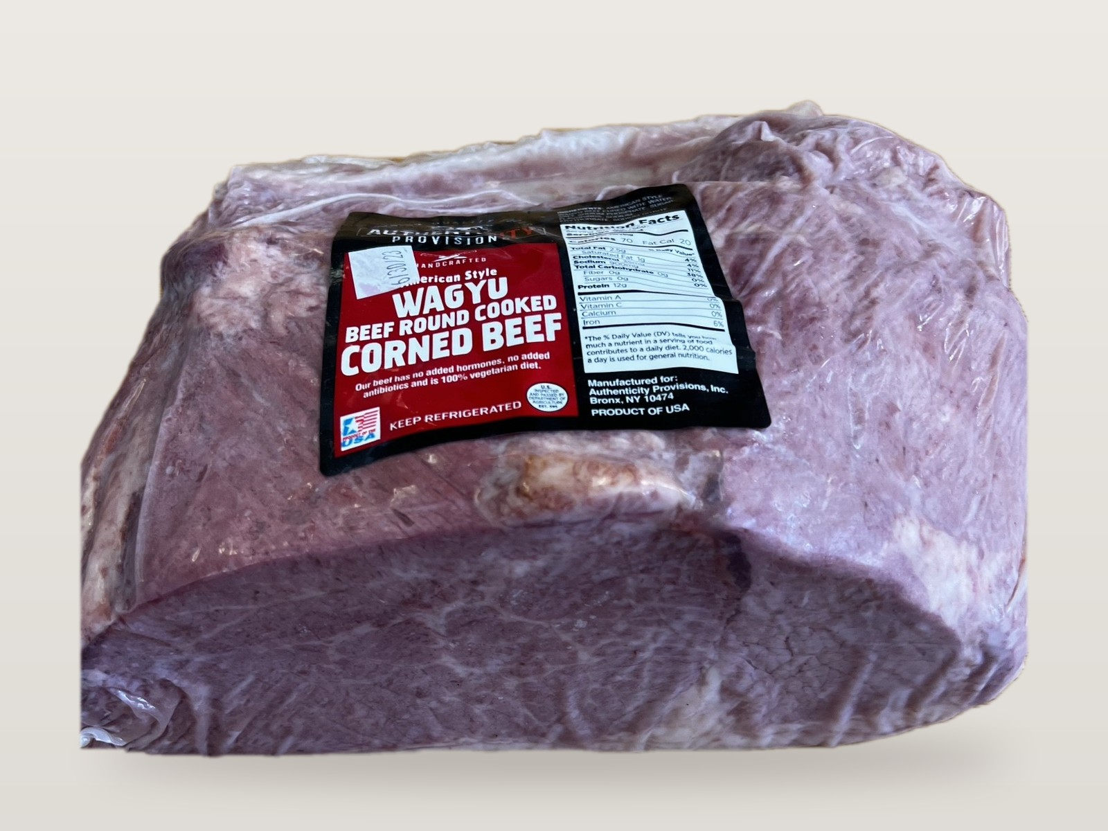 AuthentiCITY Provisions Wagyu Beef Round Cooked Corned Beef, vacuum packed, showing the cut face